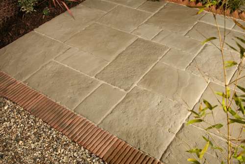 Old Mill with Regency terracotta tile-on-edge and saw-tooth edging